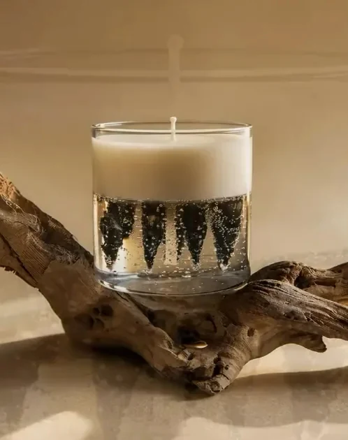 Glass soy candle on natural wood